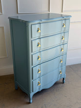 Load image into Gallery viewer, A classic French Provincial silhouette refreshed with a clean, modern lacquer finish. This vintage five-drawer chest features softly shaped drawer fronts, a gently serpentine apron, and cabriole-style feet that give it an elegant, airy profile. Finished in a custom Parma Gray mix, the color reads as a sophisticated blue-gray that shifts beautifully with natural light, and it’s completed with polished brass ginkgo leaf hardware for a warm, sculptural contrast. Good Bones Furniture