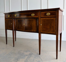 Load image into Gallery viewer, Vintage Hickory Chair sideboard showcasing classic Federal-inspired styling with beautifully banded mahogany veneers, graceful serpentine lines, and tapered legs. The thoughtfully designed layout includes three drawers above three cabinet compartments, offering versatile storage for dining essentials, serving pieces, or barware. Rich mahogany grain, satin brass hardware, and refined inlay details. Good Bones Furniture