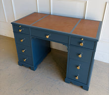 Load image into Gallery viewer, This vintage desk has been professionally lacquered in Farrow & Ball Hague Blue, giving the classic form a rich, tailored presence. The leather inset top adds warmth and contrast, while new brass knobs provide a refined finishing touch. Good Bones Furniture