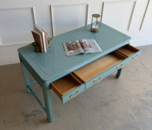 Load image into Gallery viewer, This vintage Lane Furniture writing desk features a restrained Asian-inspired silhouette with softly rounded corners, inset panel detailing, and sculptural legs connected by low stretchers that give the piece a grounded, furniture-quality presence. Custom lacquered teal. Good Bones Furniture