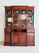 Load image into Gallery viewer, This vintage mahogany china cabinet is a striking storage and display piece defined by its distinctive bubble glass doors and substantial scale. The upper cabinet offers beautiful display space for china, glassware, books, or collected objects, while the lower section provides generous concealed storage to keep a room feeling organized and polished. Good Bones Furniture