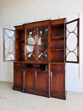 Load image into Gallery viewer, This vintage mahogany china cabinet is a striking storage and display piece defined by its distinctive bubble glass doors and substantial scale. The upper cabinet offers beautiful display space for china, glassware, books, or collected objects, while the lower section provides generous concealed storage to keep a room feeling organized and polished. Good Bones Furniture