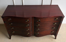 Load image into Gallery viewer, Graceful curves and timeless craftsmanship define this vintage mahogany dresser. Featuring a distinctive serpentine front with eight spacious drawers, this piece offers elegant proportions and exceptional storage while maintaining a refined footprint. Traditional bracket feet, classic oval brass hardware, and rich mahogany construction give the dresser a sophisticated presence that works beautifully in both traditional and transitional interiors. Good Bones Furniture