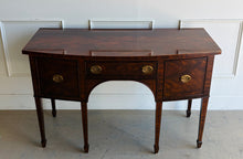 Load image into Gallery viewer, This vintage Maitland-Smith sideboard showcases the brand’s renowned craftsmanship and elegant neoclassical styling. Crafted with richly figured mahogany veneers, the serpentine front and graceful arched apron create a sophisticated silhouette, while brass lion-head hardware and tapered inlaid legs add refined details throughout. Good Bones Furniture