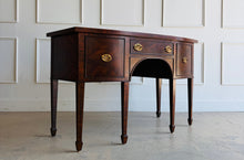 Load image into Gallery viewer, This vintage Maitland-Smith sideboard showcases the brand’s renowned craftsmanship and elegant neoclassical styling. Crafted with richly figured mahogany veneers, the serpentine front and graceful arched apron create a sophisticated silhouette, while brass lion-head hardware and tapered inlaid legs add refined details throughout. Good Bones Furniture