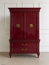 Load image into Gallery viewer, This vintage Mediterranean armoire has bold 1970s Spanish Revival styling with carved frieze detail, stepped door panels, burl veneer accents, and original brass ring hardware. The warm walnut-toned finish highlights the depth of the veneer, while the interior offers generous concealed storage with built-in drawers. Good Bones Furniture