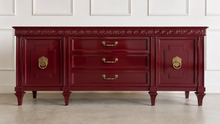 Load image into Gallery viewer, This vintage Mediterranean/ Spanish Revival credenza dresser has the scale, craftsmanship, and presence that make 1970s American case goods so collectible. The design features a carved scrolling frieze, burl veneer door panels, architectural legs, and original brass ring hardware with geometric backplates. Good Bones Furniture