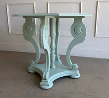 Load image into Gallery viewer, restored vintage foyer table. Professionally refinished in a custom mint green lacquer, this charming octagonal accent table pairs graceful neoclassical styling with a crisp contemporary finish. The sculptural pedestal base features scrolling supports, carved acanthus leaf details, and turned center elements that create visual interest from every angle. Good Bones Furniture