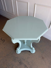 Load image into Gallery viewer, restored vintage foyer table. Professionally refinished in a custom mint green lacquer, this charming octagonal accent table pairs graceful neoclassical styling with a crisp contemporary finish. The sculptural pedestal base features scrolling supports, carved acanthus leaf details, and turned center elements that create visual interest from every angle. Good Bones Furniture