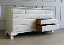 Load image into Gallery viewer, This vintage dresser by National Mt. Airy combines traditional craftsmanship with a fresh, updated finish. The silhouette is classic and balanced, with softly shaped feet, subtle crown molding, and clean paneled drawer fronts that give the piece a tailored, timeless presence. Professionally lacquered in a custom greige, the finish brings a versatile neutral tone that feels warm, refined, and easy to place in a range of interiors. Good Bones Furniture
