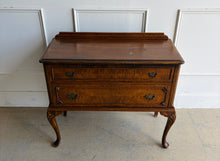 Load image into Gallery viewer, This vintage Queen Anne-style two drawer chest features richly figured wood grain, graceful cabriole legs, carved corner details, and classic brass hardware. The compact scale makes it especially versatile as a bedside chest, entryway piece, small dresser, or accent cabinet. Good Bones Furniture