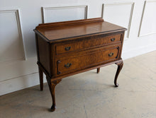 Load image into Gallery viewer, This vintage Queen Anne-style two drawer chest features richly figured wood grain, graceful cabriole legs, carved corner details, and classic brass hardware. The compact scale makes it especially versatile as a bedside chest, entryway piece, small dresser, or accent cabinet. Good Bones Furniture