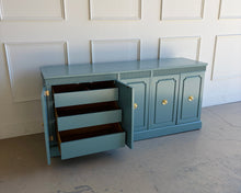 Load image into Gallery viewer, This vintage Stanley credenza brings mid-century simplicity and strong proportions together in a fresh, elevated finish. Lacquered in Benjamin Moore Aegean Teal by Good Bones Furniture.