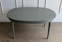 Load image into Gallery viewer, This vintage Thomasville dining table features a clean oval silhouette, tapered fluted legs, and understated neoclassical detailing that gives it a tailored, architectural presence without feeling overly formal. Custom lacquered in Lauriston Stone. Good Bones Furniture