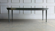 Load image into Gallery viewer, This vintage Thomasville dining table features a clean oval silhouette, tapered fluted legs, and understated neoclassical detailing that gives it a tailored, architectural presence without feeling overly formal. Custom lacquered in Lauriston Stone. Good Bones Furniture