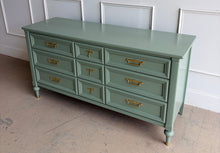 Load image into Gallery viewer, This vintage seven drawer dresser by White Furniture Co. showcases the exceptional craftsmanship and timeless proportions that made the North Carolina manufacturer one of America's most respected furniture makers. Professionally lacquered in custom light green, this piece can complement everything from traditional interiors to today's transitional and modern homes. Good Bones Furniture
