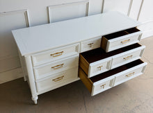 Load image into Gallery viewer, This vintage seven drawer dresser by White Furniture Co. showcases the exceptional craftsmanship and timeless proportions that made the North Carolina manufacturer one of America's most respected furniture makers. Professionally lacquered in White Dove by Benjamin Moore, this piece can complement everything from traditional interiors to today's transitional and modern homes. Good Bones Furniture