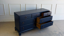 Load image into Gallery viewer, A tailored, heirloom-quality piece from White Furniture Company, known for its exceptional craftsmanship and legacy of producing some of the finest American case goods of the 20th century. This vintage dresser features clean, classic lines with a slightly raised base and understated detailing—giving it a timeless, versatile profile that works across traditional and transitional interiors. Sherwin Williams Naval. Good Bones Furniture