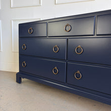 Load image into Gallery viewer, A tailored, heirloom-quality piece from White Furniture Company, known for its exceptional craftsmanship and legacy of producing some of the finest American case goods of the 20th century. This vintage dresser features clean, classic lines with a slightly raised base and understated detailing—giving it a timeless, versatile profile that works across traditional and transitional interiors. Sherwin Williams Naval. Good Bones Furniture