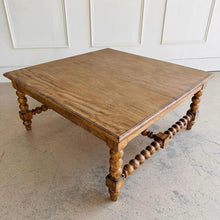 Load image into Gallery viewer, The Wellmington Coffee Table is a beautiful statement piece that brings both character and functionality to any living space. Crafted from solid Mango wood, it features stunning large bobbin legs and cross braces that highlight its traditional craftsmanship. The substantial square design ensures ample surface area, making it perfect for both decorative displays and everyday use. Good Bones Furniture