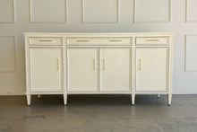 Load image into Gallery viewer, Avalaire Sideboard in Marion White by Good Bones Furniture, a solid mahogany storage cabinet with paneled doors, tapered legs, and a crisp, timeless silhouette.