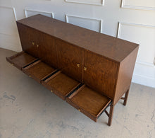 Load image into Gallery viewer, Basil Sideboard with all four drawers open displaying concealed storage beneath walnut burl cabinet doors and brass pulls.
