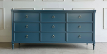 Load image into Gallery viewer, Boylan 9-drawer dresser in Rain Cloud, crafted from solid mahogany and mahogany veneers, featuring soft-close drawers and brass ring pulls