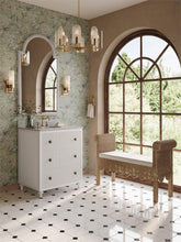 Load image into Gallery viewer, Newport Scalloped Bench styled in a bathroom interior, featuring natural rattan frame and Arctic White performance fabric cushion beneath arched windows.