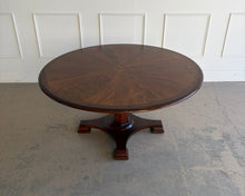 Load image into Gallery viewer, Lower angled view of the Stanley Furniture Co. round dining table highlighting the warm wood tabletop and the pedestal base beneath.