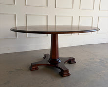 Load image into Gallery viewer, Side angled view of the Stanley Furniture Co. round dining table showing the pedestal base, flared feet, and partial tabletop.