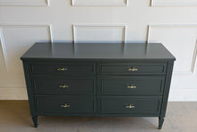 Load image into Gallery viewer, Vintage six-drawer dresser in Farrow & Ball Studio Green lacquer with clean architectural lines, tapered legs, and updated acrylic and brass pulls, refinished by Good Bones Furniture.