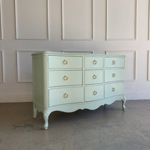 Load image into Gallery viewer, Vintage French dresser shown from an alternate angle, highlighting its curved form, cabriole legs, and painted finish.