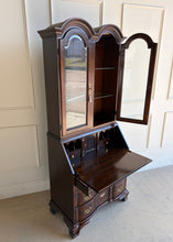 Load image into Gallery viewer, Side profile of vintage Hooker mahogany secretary desk with open drop-front, curved bracket feet, and traditional brass hardware.
