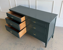Load image into Gallery viewer, Vintage six-drawer dresser in Farrow & Ball Studio Green with drawers open to reveal spacious storage, clear acrylic and brass hardware, and a professionally lacquered finish by Good Bones Furniture.