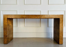 Load image into Gallery viewer, Make a statement with the bold beauty of the Burlwood Console Table. Featuring a sleek, continuous silhouette and book-matched burl veneer, this piece delivers luxurious texture and refined modernism in one dramatic package. Good Bones Furniture