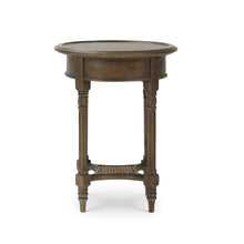 Load image into Gallery viewer, The Bramble Montego Side Table brings together classic craftsmanship and relaxed texture through its solid mahogany construction, hand-carved detailing, and woven rattan lower shelf. The round silhouette and slender turned legs give the piece an airy, collected feel, making it ideal beside a sofa, lounge chair, or bedside. Good Bones Furniture
