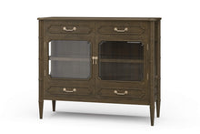 Load image into Gallery viewer, The Bramble Grosvenor Sideboard blends elegant display space with practical storage. Crafted from solid mahogany, it features two glass-front doors, a spacious illuminated interior, and a full-width shelf for displaying glassware, serving pieces, or treasured collections. Four drawers keep smaller essentials neatly organized. Bamboo-inspired moldings, tapered legs, and brass-finished hardware lend the piece a refined, tailored character. Good Bones Furniture

