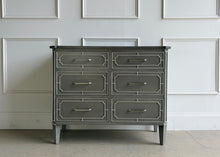 Load image into Gallery viewer, Inspired by antique Regency pieces, the Ambrose Chest by Ambella Homeblends classic architectural detailing with a refined, modern finish. Regency-style fretwork frames each of the six drawers, creating layered dimension and tailored symmetry across the façade. Good Bones Furniture
