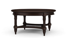 Load image into Gallery viewer, The Bramble Montego Round Coffee Table blends classic island-inspired design with refined craftsmanship. Built from solid mahogany, the table features a substantial round top supported by turned legs and a sculptural lower stretcher with woven rattan detailing that adds warmth, texture, and visual depth. Good Bones Furniture
