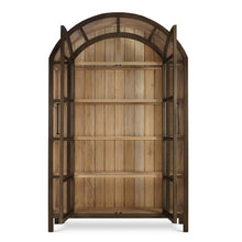 Load image into Gallery viewer, The Vannes 2 Door Display Cabinet from Bramble combines architectural scale with warm natural materials, creating a statement piece designed for both storage and display. Crafted from solid mahogany, the cabinet features a dramatic arched silhouette with glass-paneled doors framed in a rich contrasting finish that highlights the craftsmanship and curvature of the design. Good Bones Furniture
