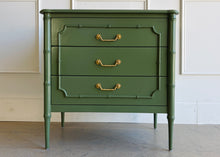 Load image into Gallery viewer, Classic faux bamboo with elevated detail. The Bramble Chelsea bedside table delivers a perfect balance of timeless coastal design and exceptional craftsmanship. Made from solid mahogany, this piece features elegant faux bamboo framing, tapered legs, and beautifully carved fretwork detailing on each drawer front. Solid brass hardware. Good Bones Furniture
