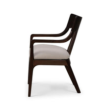 Load image into Gallery viewer, The Bramble Colorado Dining Armchair pairs sculptural lines with the lasting beauty of solid mahogany. Its gently curved backrest flows into slender arms, while an open-back design and tapered legs create a light, tailored silhouette. Generously cushioned seat upholstered in performance fabric. Good Bones Furniture
