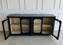 Load image into Gallery viewer, The Bramble Milano Sideboard blends traditional craftsmanship with eye-catching detail, making it the perfect statement piece for dining rooms, living spaces, or entryways. Handcrafted from solid mahogany, it features elegant stacked turning details and four framed glass-panel cabinet doors. Good Bones Furniture
