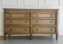 Load image into Gallery viewer, The Camelot Dresser blends refined simplicity with enduring craftsmanship. Built from solid mango wood and mango wood veneers, this six-drawer dresser is designed with clean, elegant lines and dovetailed drawer construction—ensuring it's as durable as it is beautiful. Each of the six spacious drawers glides smoothly on metal undermount self closing glides. Good Bones Furniture
