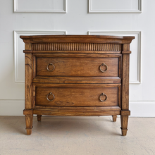 Load image into Gallery viewer, The Camelot Nightstand offers refined simplicity and everyday function, crafted from durable solid mango wood. With clean lines and a warm, lightly distressed finish, this piece delivers style and substance to any bedroom or living space. Good Bones Furniture
