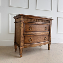 Load image into Gallery viewer, The Camelot Nightstand offers refined simplicity and everyday function, crafted from durable solid mango wood. With clean lines and a warm, lightly distressed finish, this piece delivers style and substance to any bedroom or living space. Good Bones Furniture
