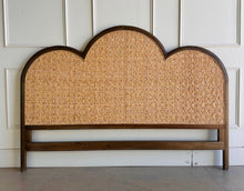 Load image into Gallery viewer, Bring a little softness and natural texture to your bedroom with the Chloe Scalloped Rattan Headboard. Its graceful scalloped silhouette frames a natural rattan inset, creating a warm, inviting focal point above the bed. The Straw Wash finish gives the frame a gently lightwashed look, making it easy to pair with layered linens and collected accents. Good Bones Furniture
