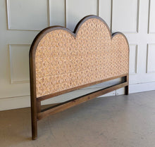 Load image into Gallery viewer, Bring a little softness and natural texture to your bedroom with the Chloe Scalloped Rattan Headboard. Its graceful scalloped silhouette frames a natural rattan inset, creating a warm, inviting focal point above the bed. The Straw Wash finish gives the frame a gently lightwashed look, making it easy to pair with layered linens and collected accents. Good Bones Furniture
