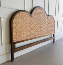 Load image into Gallery viewer, Bring a little softness and natural texture to your bedroom with the Chloe Scalloped Rattan Headboard. Its graceful scalloped silhouette frames a natural rattan inset, creating a warm, inviting focal point above the bed. The Straw Wash finish gives the frame a gently lightwashed look, making it easy to pair with layered linens and collected accents. Good Bones Furniture
