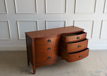 Load image into Gallery viewer, With its gently bowed front, clean lines, and understated traditional detailing, this vintage Dixie dresser offers a timeless silhouette that works beautifully in both classic and updated interiors. Six spacious drawers provide practical everyday storage, while the balanced proportions give the piece a tailored, versatile presence. Offered lacquered in your color of choice. Good Bones Furniture
